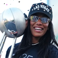 Oct 17, 2025; Las Vegas, NV, USA; Las Vegas Aces center A'Ja Wilson (22) celebrates during the 2025 WNBA Championship parade at Toshiba Plaza. Mandatory Credit: Stephen R. Sylvanie-Imagn Images