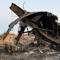 Remains from the UPS cargo plane crash affecting one of the surrounding businesses, Grade A Auto Parts, in Louisville, Ky.