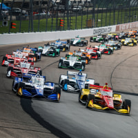 Race cars on a racetrack outside