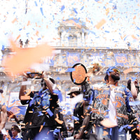 Karl-Anthony Towns #32 of the New York Knicks celebrates with the Larry O'Brien Championship Trophy