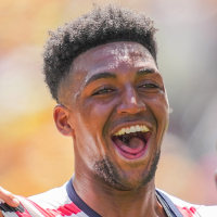 Alex Freeman of the United States celebrates a goal surrounded by teammates on the soccer field