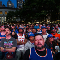 Fans react during a watch party in Bryant Park for Game 3 of the NBA Finals between New York Knicks and San Antonio Spurs on June 8, 2026. 