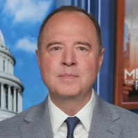 Adam Schiff seated on set
