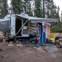 The camping trailer inhabited by Joseph and Phoenix Henrichsen, parked on a road near Gumboot Lake Campground in California.