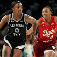 Jul 12, 2026; Las Vegas, Nevada, USA; Las Vegas Aces guard Jackie Young (0) dribbles the ball against Indiana Fever guard Kelsey Mitchell (0) during the fourth quarter of a WNBA basketball game at Michelob Ultra Arena. Mandatory Credit: Lucas Peltier-Imagn Images