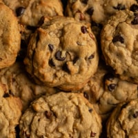 Close up of freshly baked chocolate chop cookies filling frame