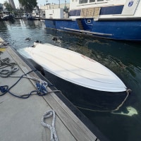 The capsized Vessel, tied to a pier after the capsizing, on Aug. 8, 2026.