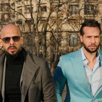 The tate brothers outside a courthouse in Romania