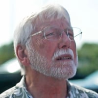 Image: A man wearing glasses