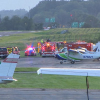 First responders gather at Carlisle Airport in Carlisle, Pennsylvania, following a fatal crash between a small plane and a state police helicopter on Wednesday.