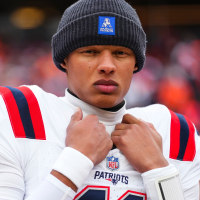 DENVER, CO - JANUARY 25: Joshua Dobbs #11 of the New England Patriots looks on from the sideline during the national anthem prior to the AFC Championship NFL football game against the Denver Broncos at Empower Field At Mile High on January 25, 2026 in Denver, Colorado. (Photo by Cooper Neill/Getty Images)