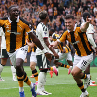 HULL, ENGLAND - AUGUST 22: Nobel Mendy of Hull City celebrates scoring his team’s second goal with teammate John Egan during the Premier League 2026/27 match between Hull City and Manchester United at MKM Stadium on August 22, 2026 in Hull, England. (Photo by George Wood/Getty Images)
