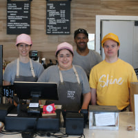 Students of Mychal's Learning Place who work at Mychal's Cafe and Bakery: Kate, Elsie, Domonic and Max.