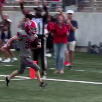 Student with Down syndrome scores touchdown during high school football game