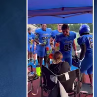 Good News: High school football team surprises mom fighting cancer with flowers