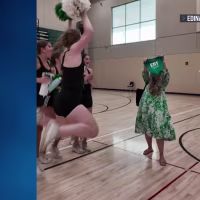 Good News: High school dance coach surprises her team with pregnancy announcement