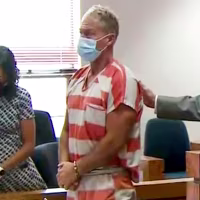 Barry Morphew, center, appears in court in Salida, Colo., on May 6, 2021.