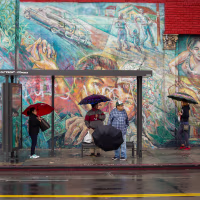 Angelenos in the  Latino neighborhood of Boyle Heights wait for a bus in 2018.