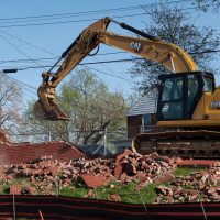 Construction workers demolish the "Spite Wall" at Morgan State University in Baltimore