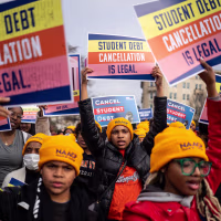 People rally to show support for the Biden administration's student debt relief plan in front of the Supreme Court on Feb. 28, 2023.