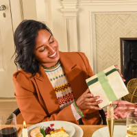 two women exchanging housewarming gifts