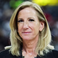 Cathy Engelbert smiles for a portrait on the court