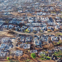 An aerial view of burned homes