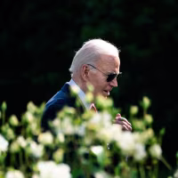 Joe Biden walking in the garden