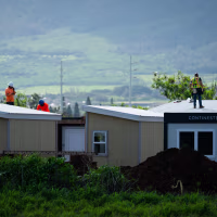 Workers building the development