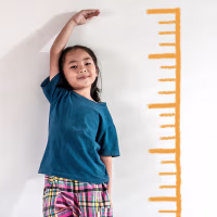 Girl measuring herself