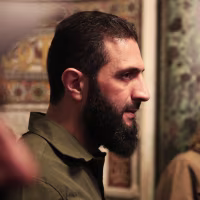 Image:Abu Mohammed al-Jolani, the leader of Syria's Islamist Hayat Tahrir al-Sham group SYRIA-CONFLICT-MOSQUE-JOLANI