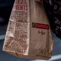A to-go bag from Chipotle.