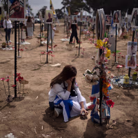 A woman grieves at a memorial for victims of the Oct. 7, 2023, Hamas attack 