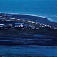 Headlights shine as people evacuate the Spit in Homer, Alaska, following a powerful earthquake in the Aleutian Islands that prompted a tsunami warning on July 22, 2020. 