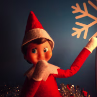 An elf spies something naughty at the Cheers from the Shelf popup bar in Washington D.C.