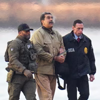 Nicolas Maduro and his wife, Cilia Flores, in handcuffs after landing at a Manhattan helipad, escorted by heavily armed Federal agents as they make their way into an armored car en route to a Federal courthouse in Manhattan on Jan. 5, 2026 in New York.