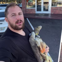 Ryan Izquierda and two frozen iguanas he foraged, which he gave to Bucks Coal Fired Pizza to turn into the final pie, shown right.