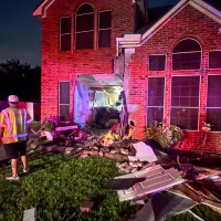 Tesla Crashes Through Katy House.