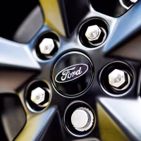 A Ford logo in the center of the rim of a wheel