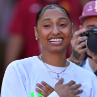 Oct 11, 2025; Los Angeles, California, USA; USC Trojans basketball player JuJu Watkins was on hand as she was named the tunnel captain the the game against the Michigan Wolverines at United Airlines Field at the Los Angeles Memorial Coliseum. Mandatory Credit: Jayne Kamin-Oncea-Imagn Images