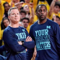 Michigan head coach Dusty May and assistance coach Mike Boynton Jr watch a free throw against Nebraska during the second half at Crisler Center in Ann Arbor on Tuesday, Jan. 27, 2026.