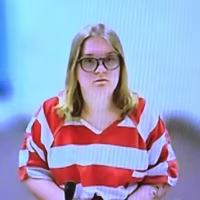 Andrea Shaw attends a court hearing remotely via video in Payette, Idaho.