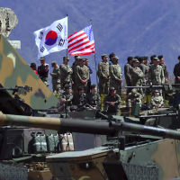 Image: South Korean and US soldiers watching from an observation post during a joint live firing drill between South Korea and the US at the Seungjin Fire Training Field in Pocheon, northeast of Seoul