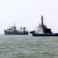 Three ships in a row on the water