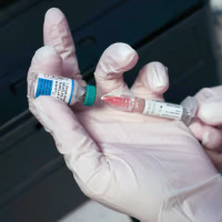 A Medical Assistant draws a measles, mumps and rubella vaccine.