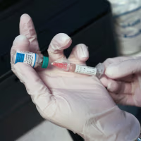A Medical Assistant draws a measles, mumps and rubella, vaccination.