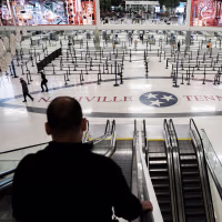 Empty lines inside an airport terminal with NASHVILLE TENNESSEE written on the floor.