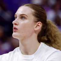 Kate Koval #13 of the LSU Tigers warms up before a basketball game.