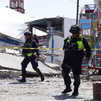Mexican State Police officers inspect the site of a fireworks blast in Santa Maria Canchesda, Mexico state, Mexico on September 6, 2026. A fireworks explosion at a church while hundreds of people were celebrating a patron saint's festival in Mexico killed at least 10 people and left more than 60 injured, authorities reported September 6, 2026.