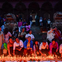 People light candles at Basantapur Durbar Square in Kathmandu, Nepal, on September 7, 2026, to honor those who lost their lives in the Bhote Koshi River floods and landslides in Rasuwa and other affected areas, as Nepal observes a national day of mourning declared by the government of Nepal. 